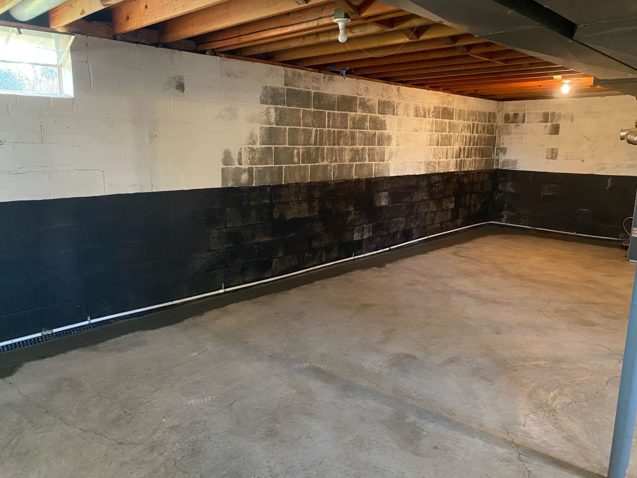 Interior drainage and crack repair combination in block basement