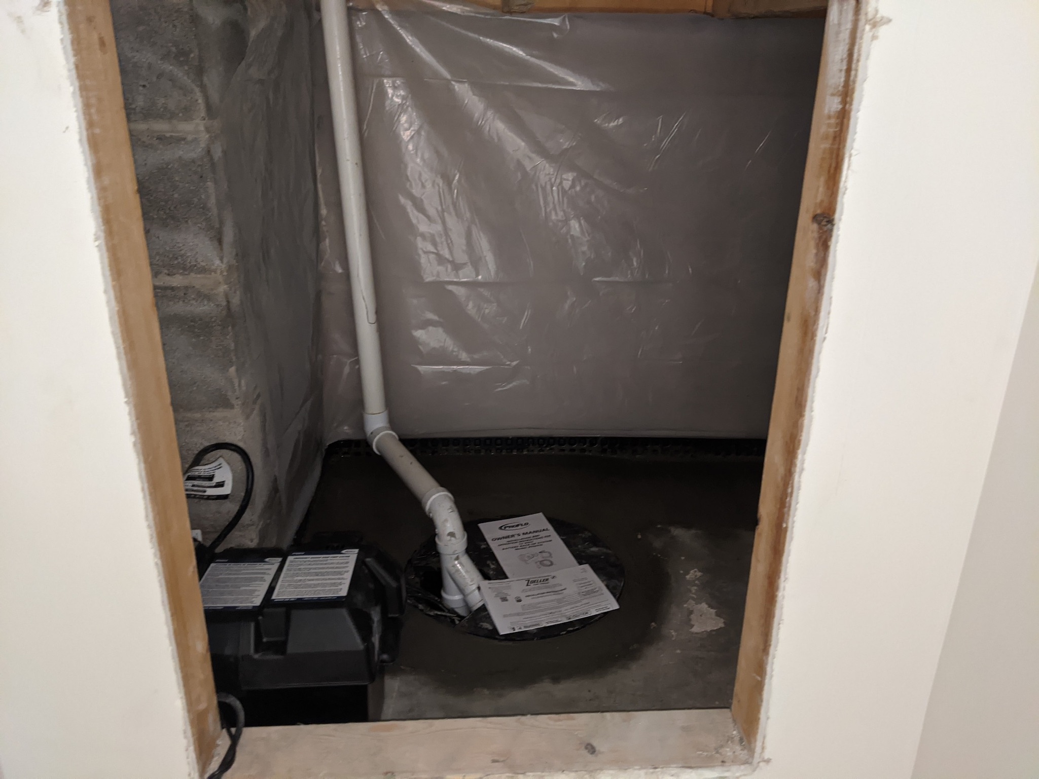 Zoeller battery backup sump pump system installed in Maryland basement with vapor barrier