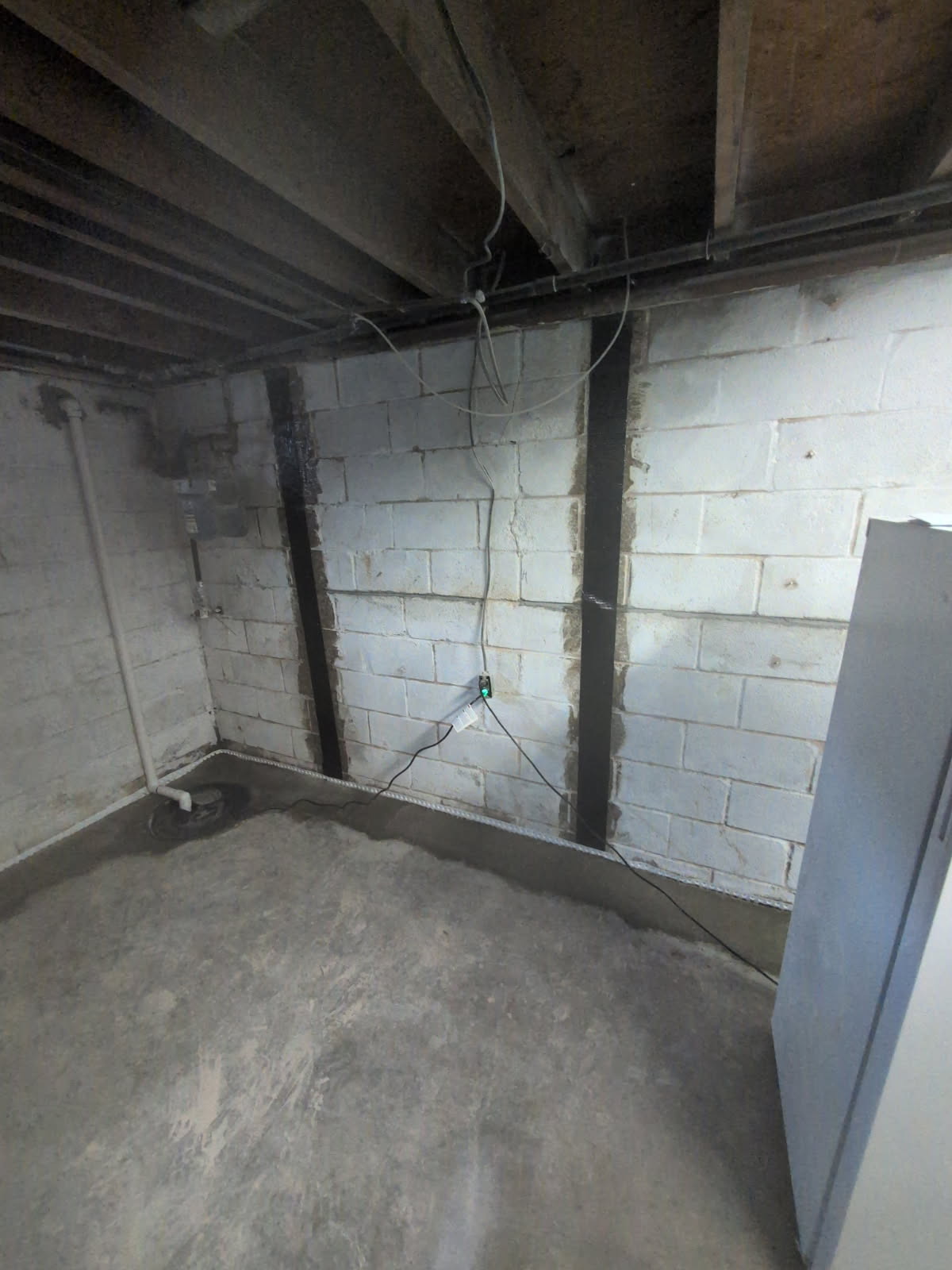 Carbon fiber reinforcement alongside step crack repair in block wall