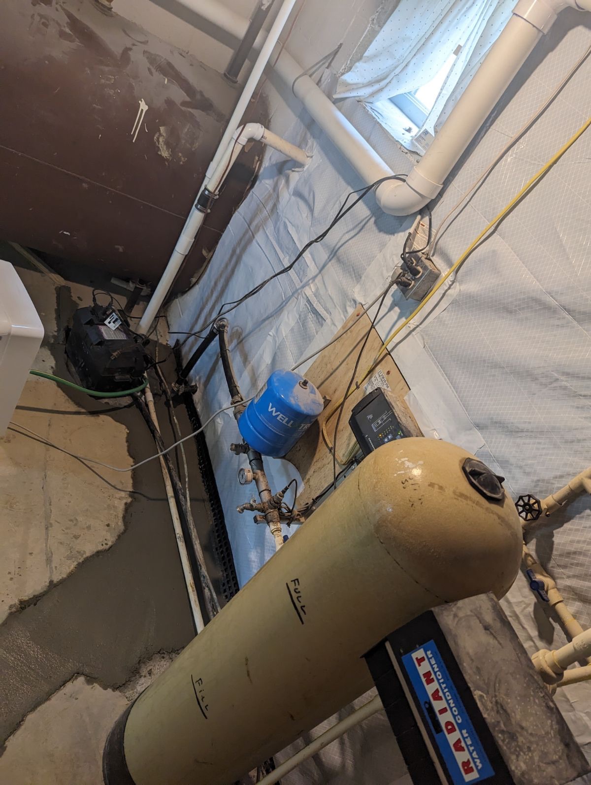 Comprehensive waterproofing system with sump, interior drainage, and vapor barrier