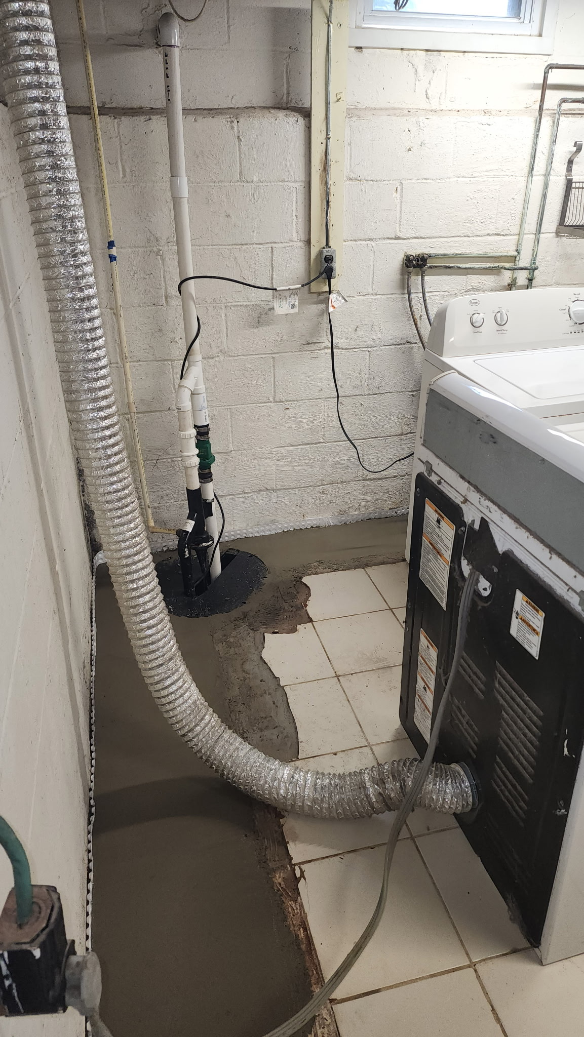 New Zoeller sump pump installation in residential basement
