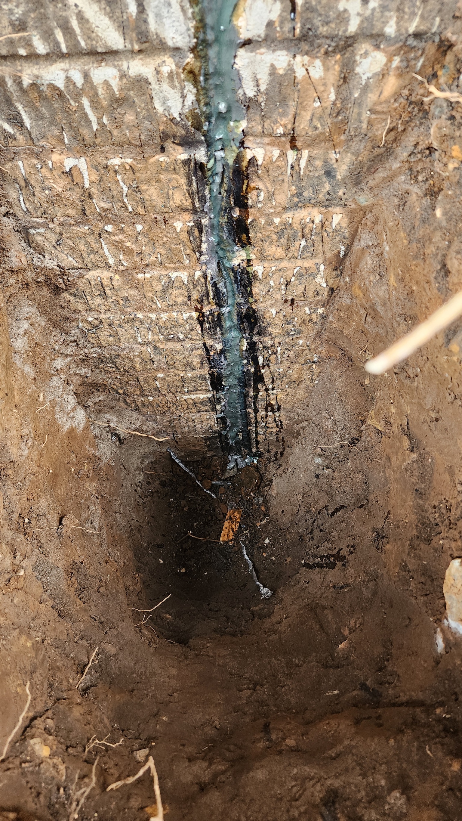 Epoxy applied to basement foundation wall crack