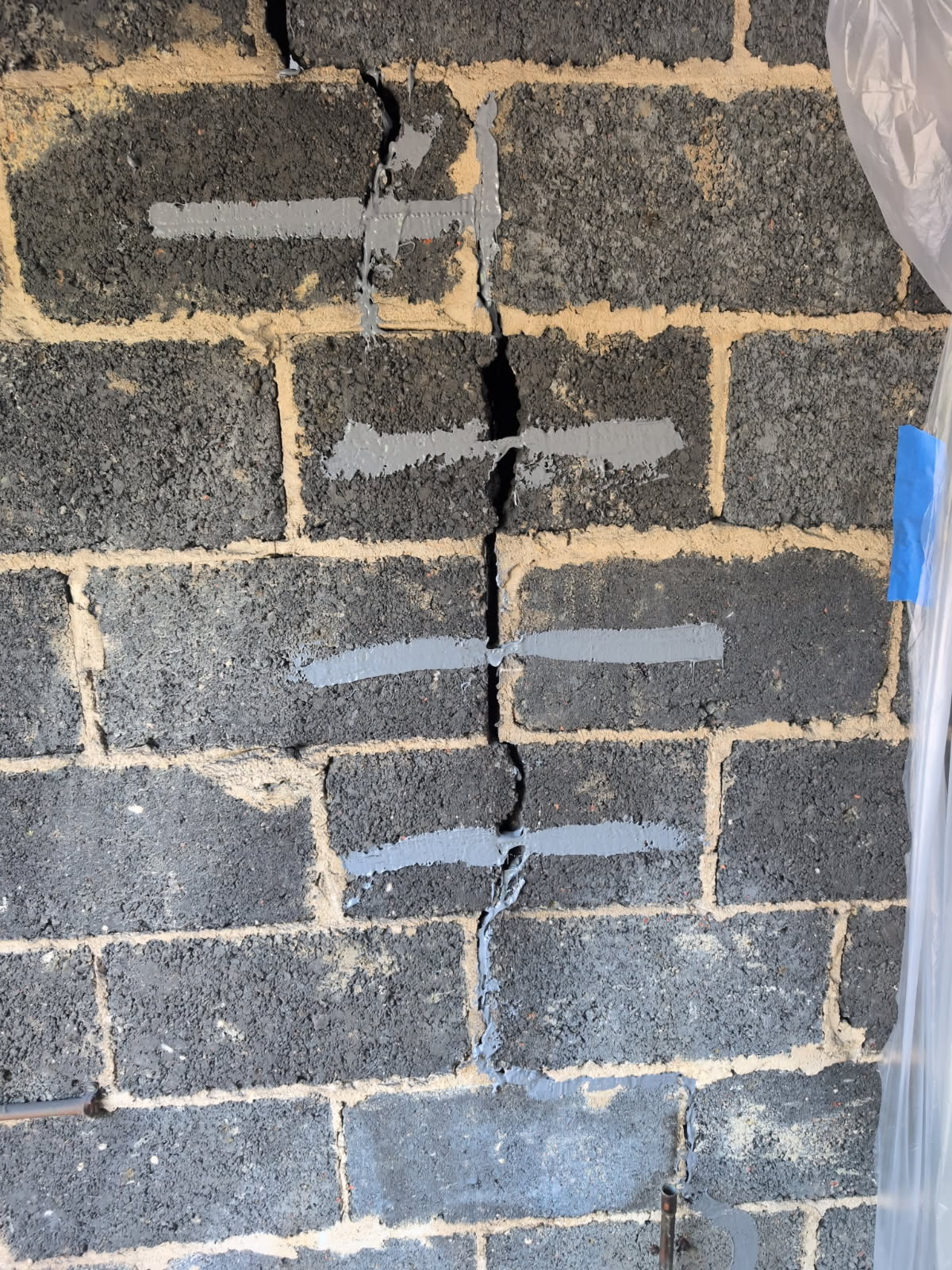 Foundation wall crack from clay soil movement in Maryland